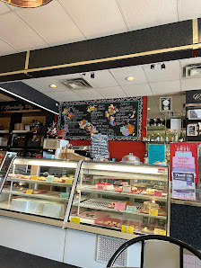 Club Cappuccino's dessert counter and colourful chalkboard menu